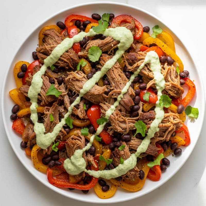 Smoky Pulled Pork Nachos with Zesty Crema