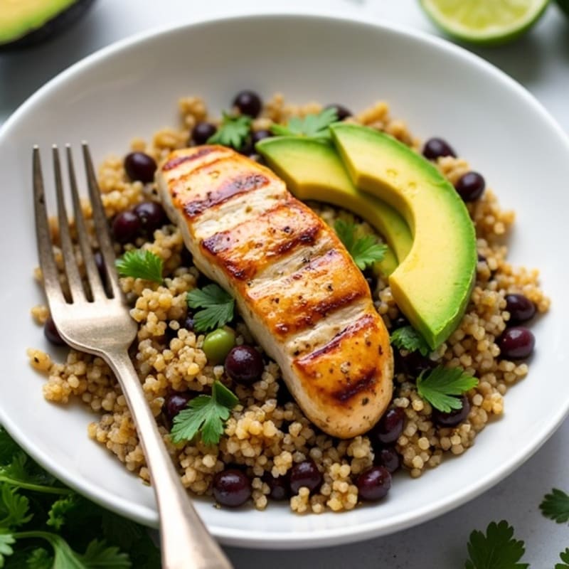 Hearty Quinoa and Black Bean Bowl with Grilled Chicken and Fresh Avocado