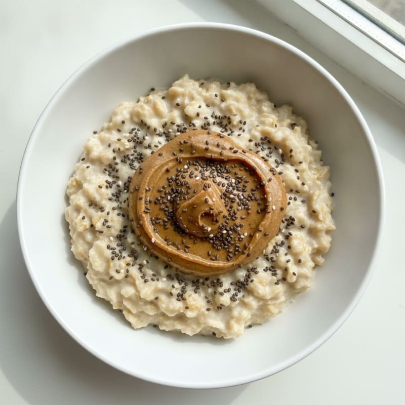 Creamy Vanilla Protein Oats with Almond Butter and Chia Seeds