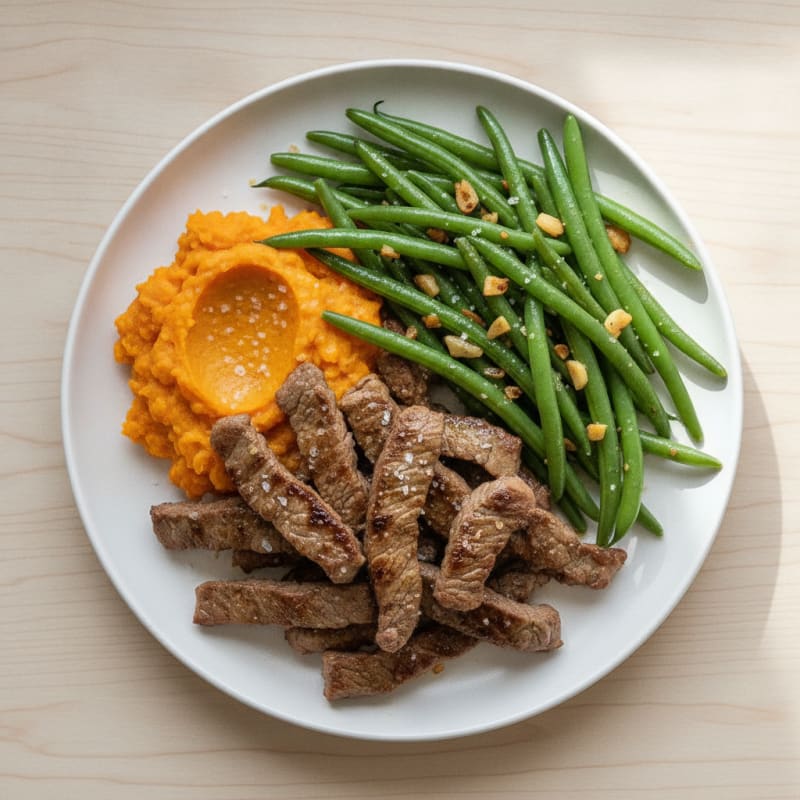 Seared Lean Beef Strips with Garlic Green Beans and Sweet Potato Mash