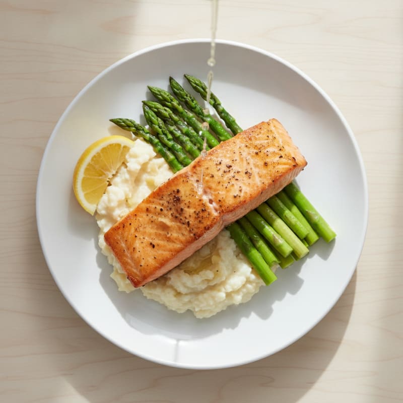 Seared Salmon Filet with Steamed Asparagus and Garlic Cauliflower Mash