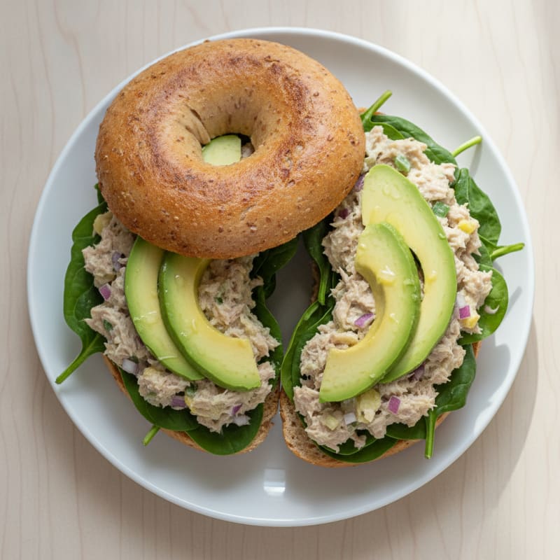 Tuna Bagel with Sliced Avocado and Spinach
