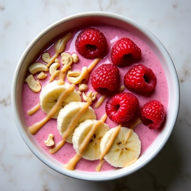 Creamy Raspberry Protein Smoothie Bowl with Vanilla Cashew Drizzle