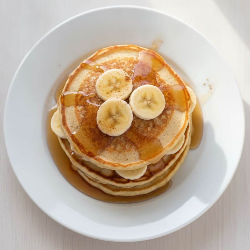 Fluffy Banana Pancakes with Maple Syrup