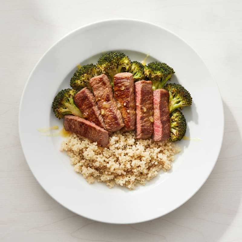 Seared Lean Beef Strips with Roasted Broccoli and Quinoa