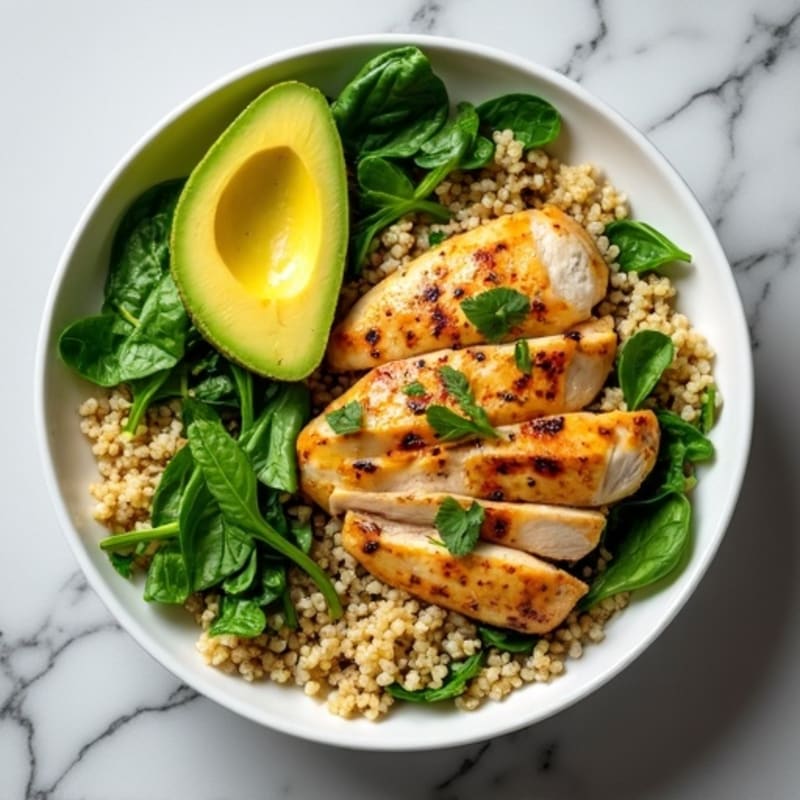 Grilled Chicken and Quinoa Bowl with Fresh Spinach and Lemon Vinaigrette