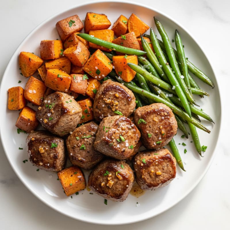 Tender Garlic Steak Tips with Roasted Sweet Potatoes