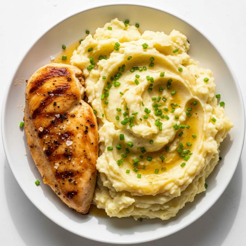 Creamy Garlic Mashed Potatoes with Chives and Seared Chicken