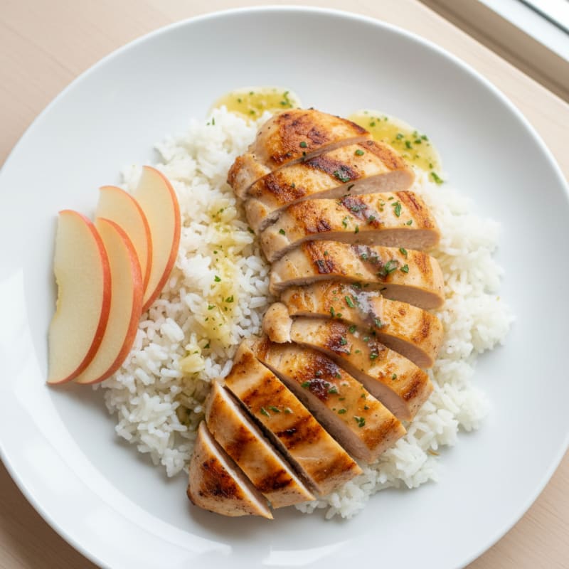 Grilled Chicken Breast with Steamed Rice and Apple Slices