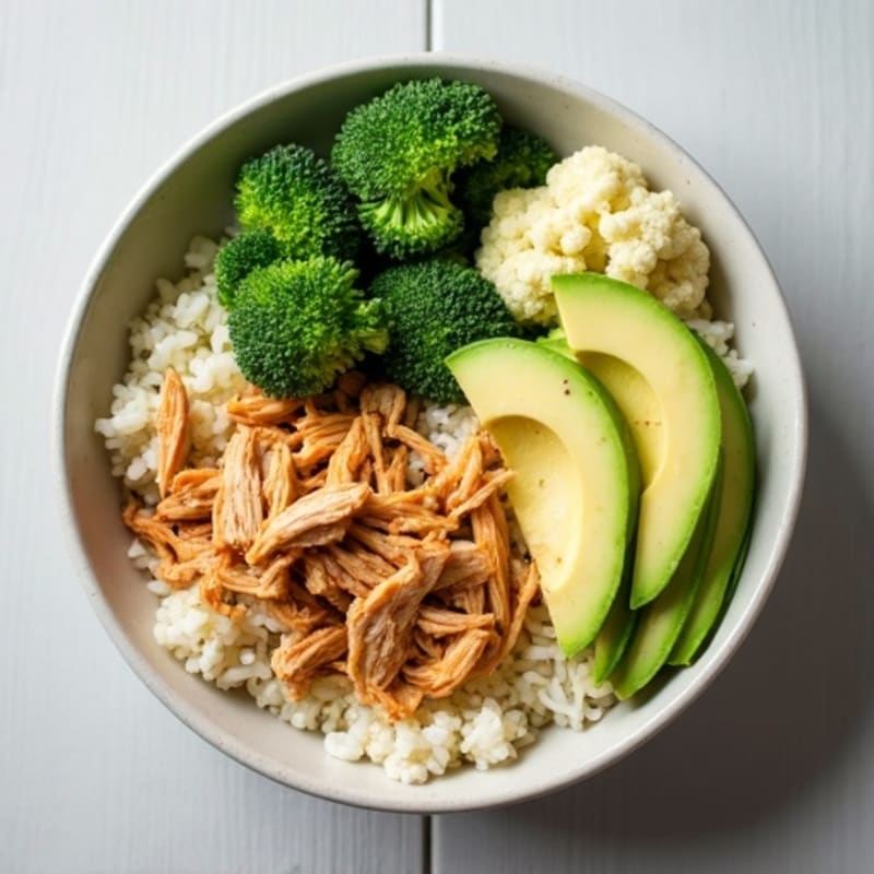 Shredded Chicken Rice Bowl with Avocado, Steamed Broccoli and Cauliflower