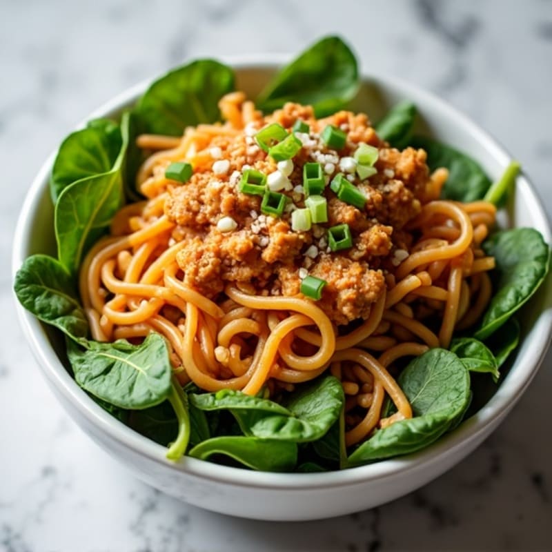 Spicy Peanut Ground Chicken Noodles with Fresh Greens