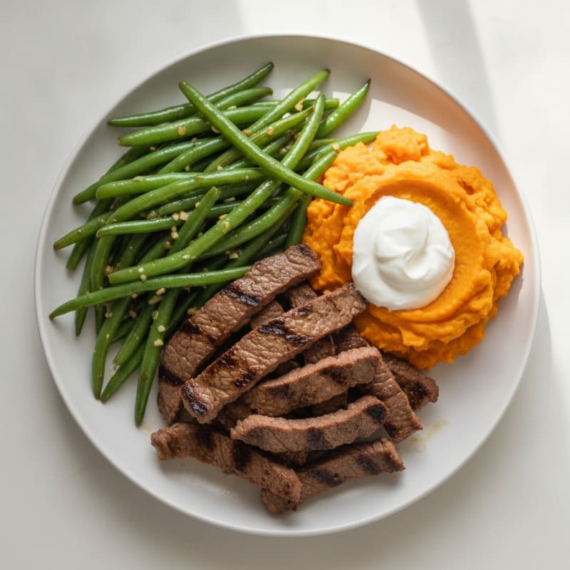 Seared Lean Beef Strips with Garlic Green Beans and Sweet Potato Mash