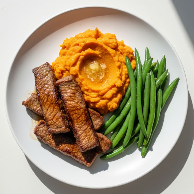 Seared Beef Strips with Steamed Green Beans and Sweet Potato Mash
