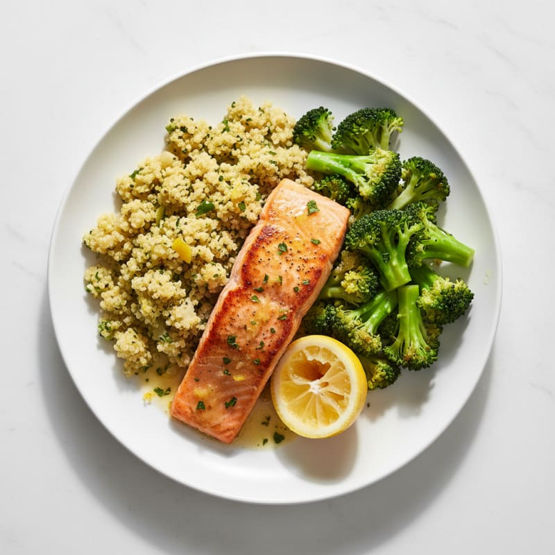 Seared Salmon Fillet with Steamed Broccoli and Lemon Herb Quinoa