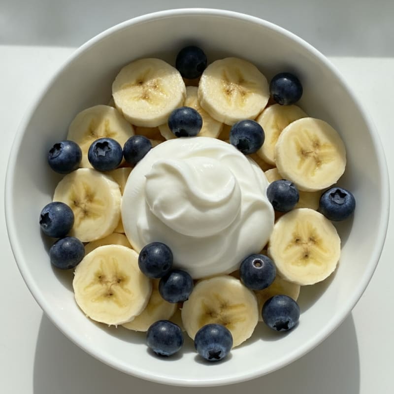 Creamy Greek Yogurt with Sliced Bananas and Blueberries