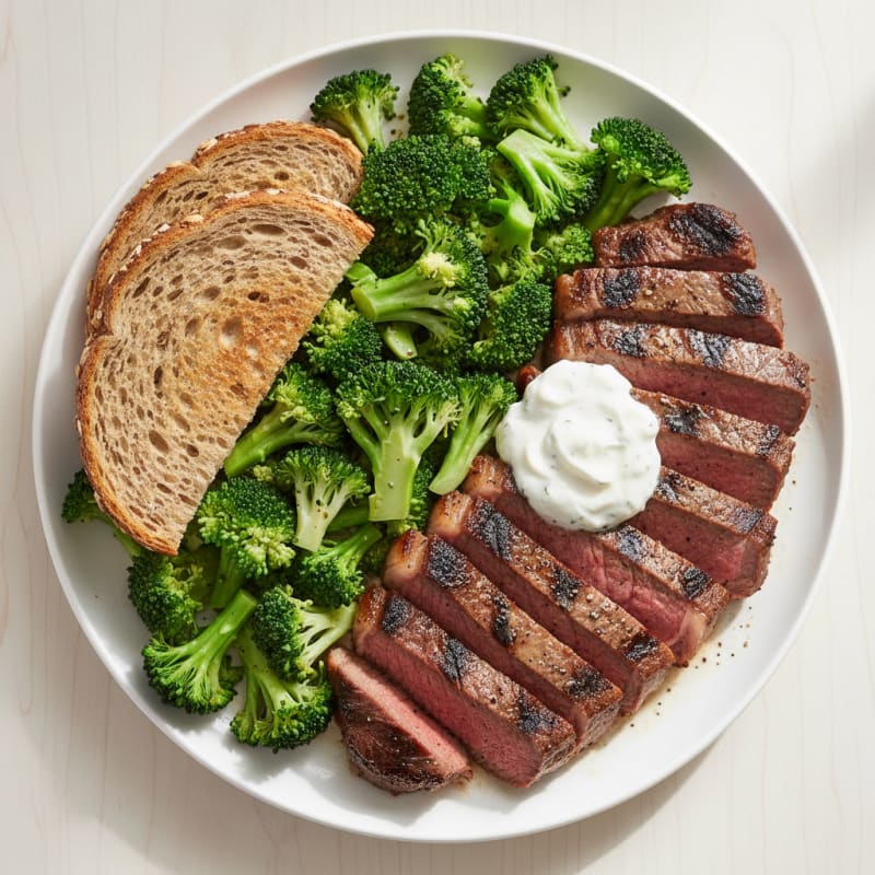 Grilled Beef Steak with Steamed Broccoli and Toasted Bread
