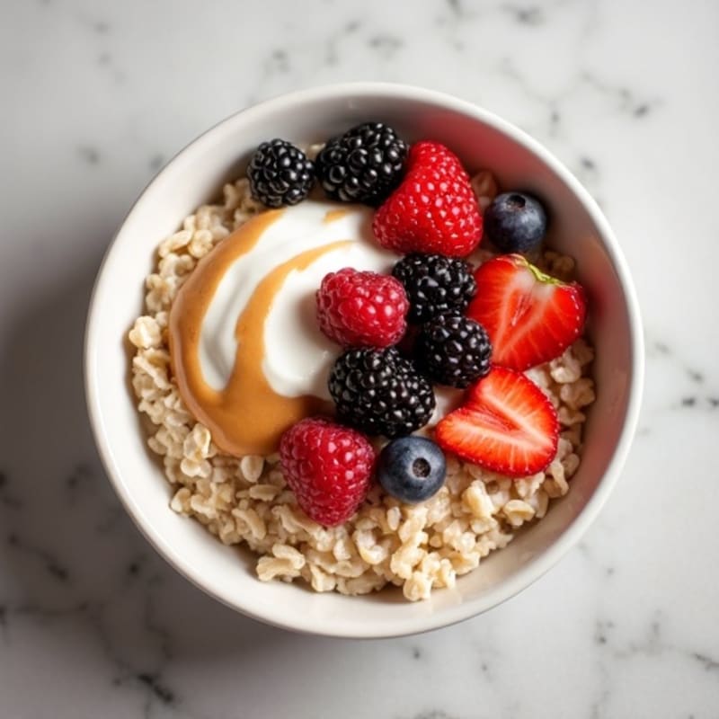 Creamy Steel Cut Oats with Almond Butter and Mixed Berries
