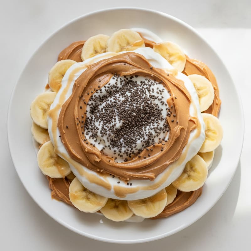 Greek Yogurt Parfait with Peanut Butter and Sliced Banana