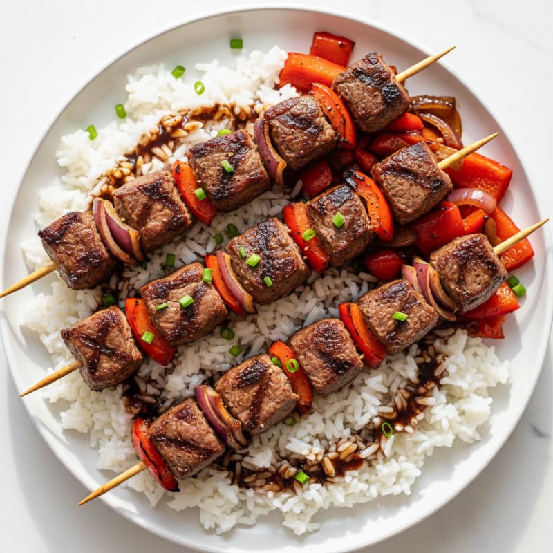 Seared Beef Kebabs with Steamed Rice and Sautéed Peppers