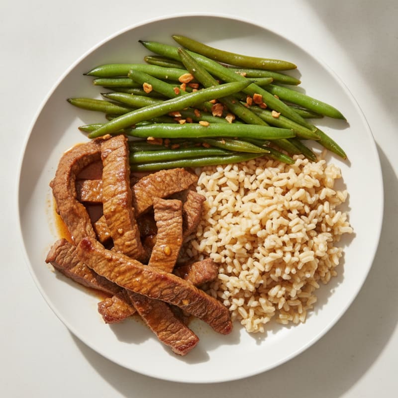 Seared Beef Strips with Garlic Green Beans and Brown Rice