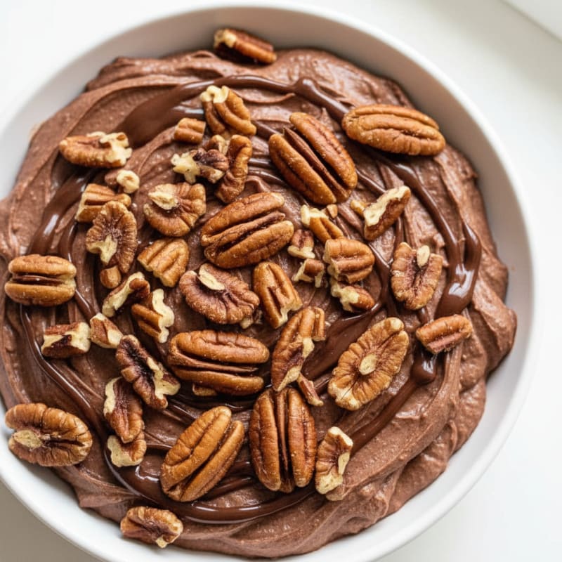 Creamy Greek Yogurt with Chocolate Protein and Chopped Pecans