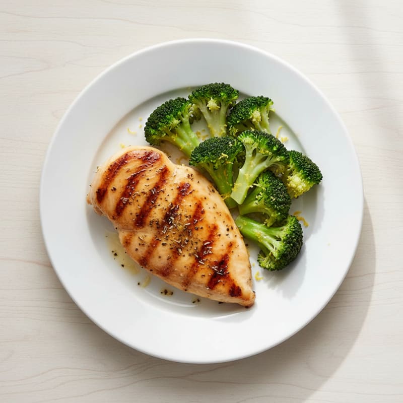 Grilled Chicken Breast with Steamed Broccoli and Lemon