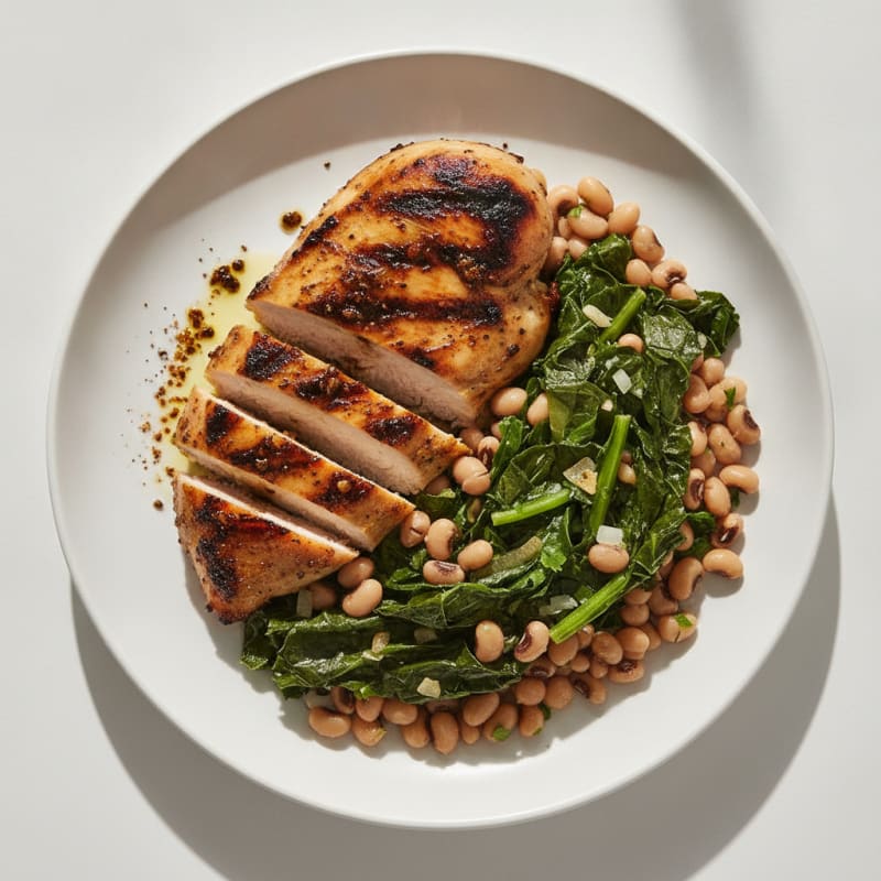 Grilled Jerk Chicken Breast with Steamed Collard Greens and Black-Eyed Peas