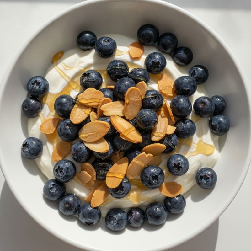 Creamy Vanilla Greek Yogurt with Berries and Almonds