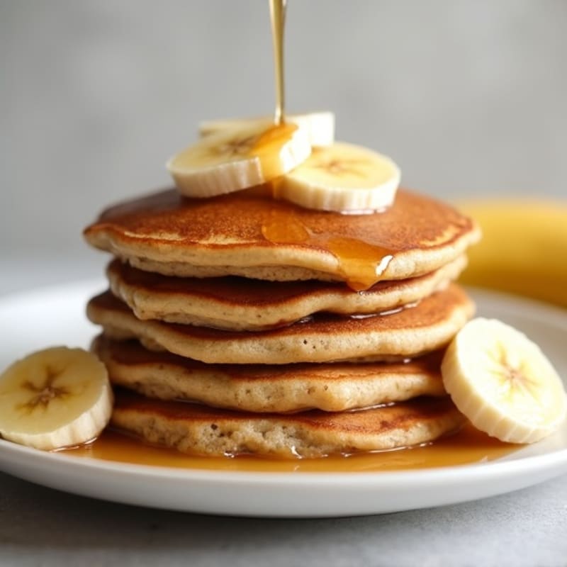 Protein-Packed Fluffy Banana Pancakes with Maple-Glazed Bananas