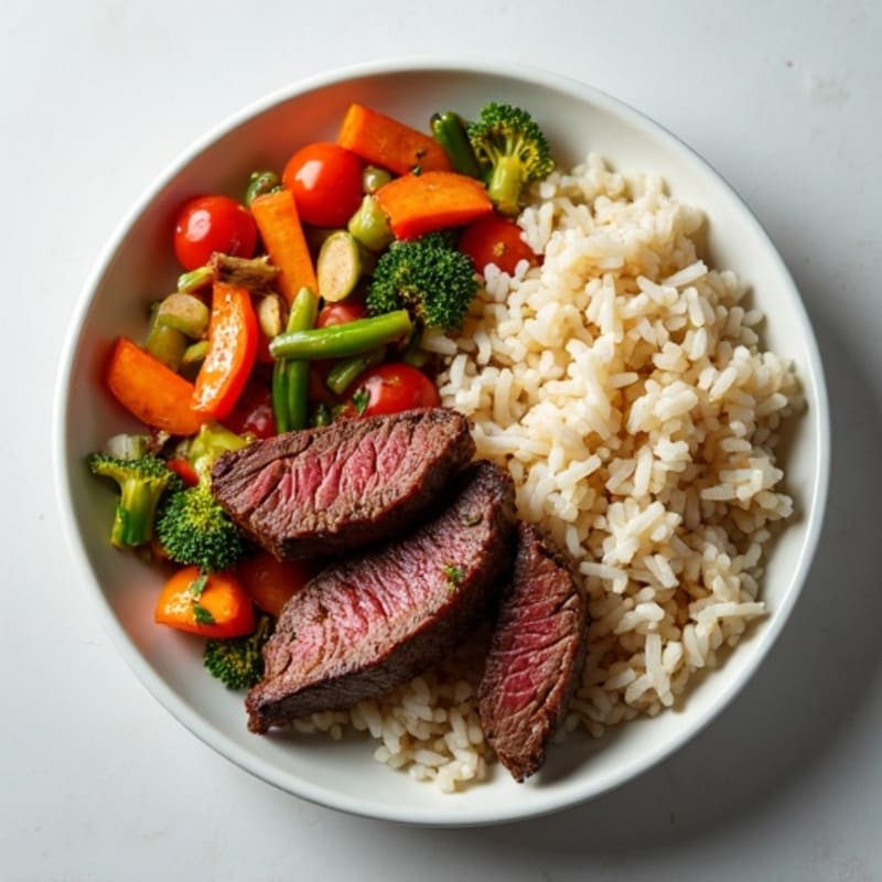 Seared Beef Strips with Vegetable Stir-Fry and Steamed Jasmine Rice