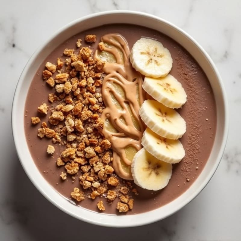 Creamy Chocolate Peanut Butter Protein Smoothie Bowl with Crunchy Topping