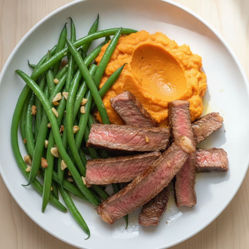 Seared Lean Beef Strips with Garlic Green Beans and Sweet Potato Mash