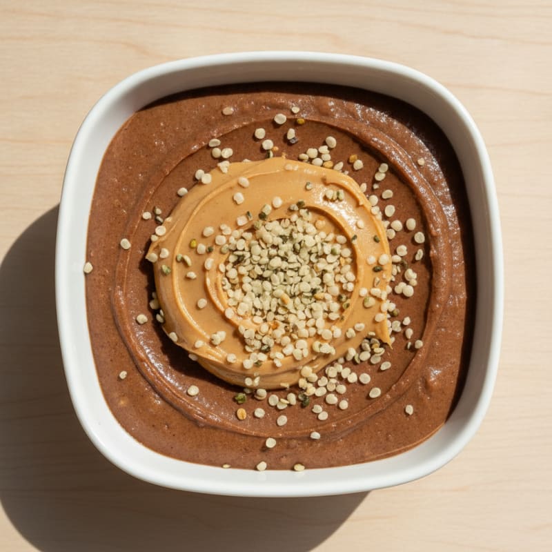 Chocolate Protein Pudding with Peanut Butter and Hemp Seeds
