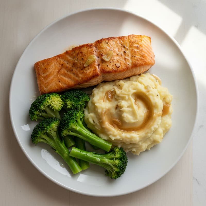 Seared Salmon Fillet with Steamed Broccoli and Garlic Mashed Potatoes