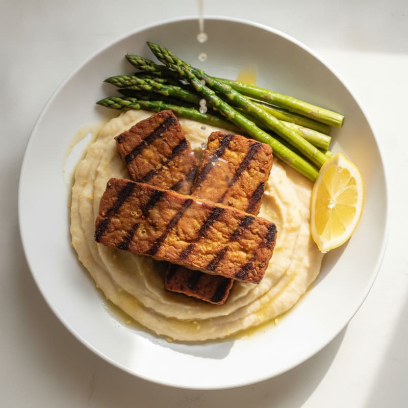 Grilled Tempeh with Creamy White Bean Mash and Steamed Asparagus