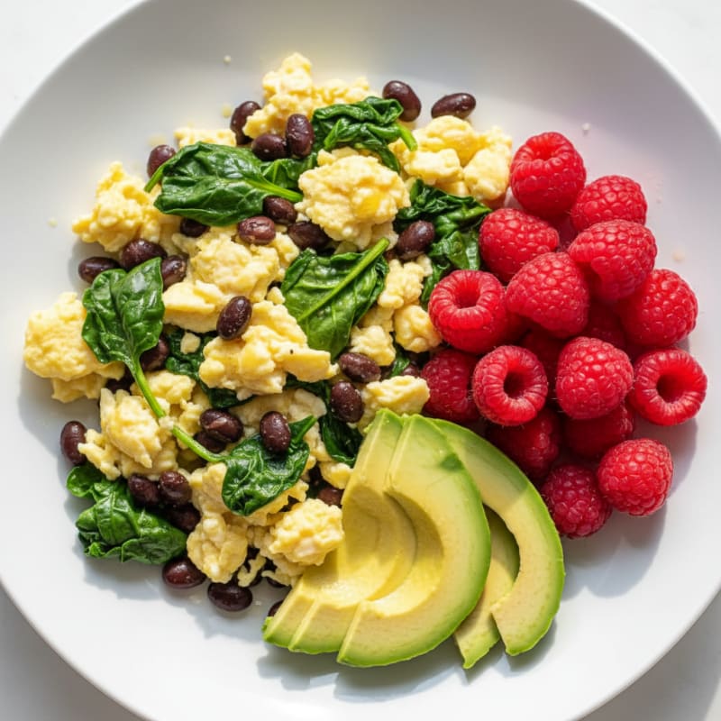 Egg and Bean Scramble with Avocado and Fresh Berries