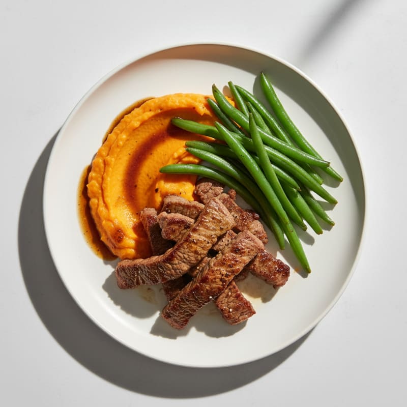 Seared Lean Beef Strips with Steamed Green Beans and Sweet Potato Mash
