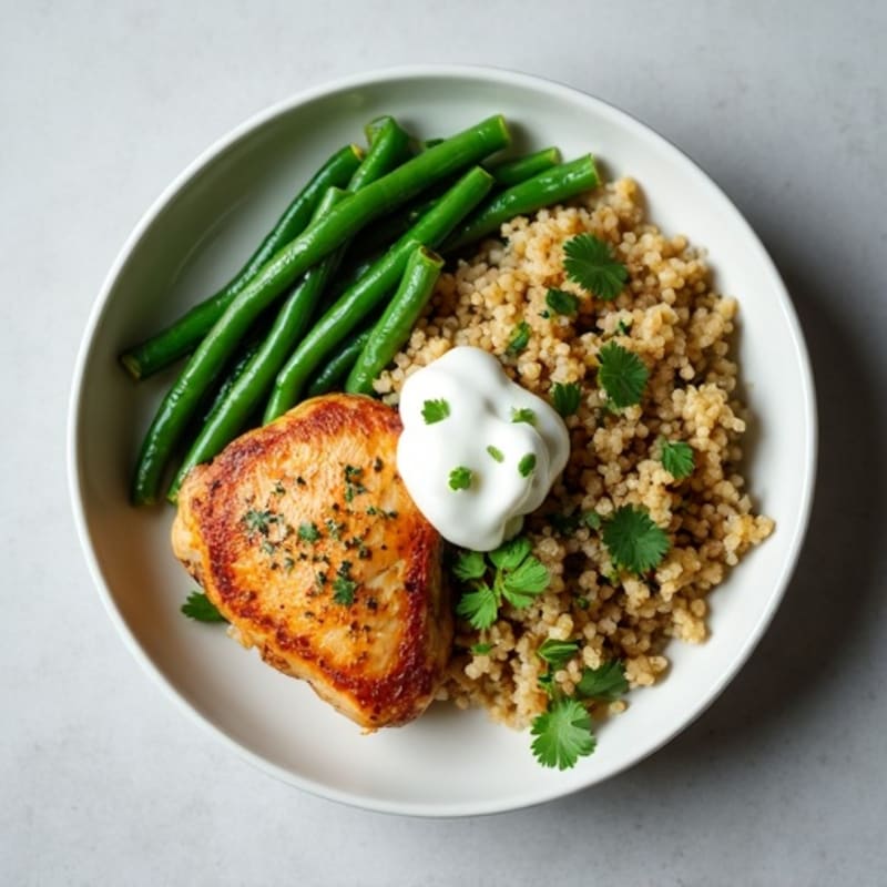 Seared Chicken Thighs with Steamed Green Beans and Herbed Quinoa