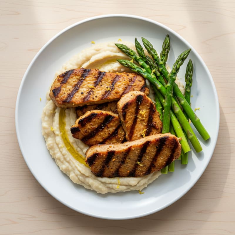 Grilled Seitan with Steamed Asparagus and White Bean Mash
