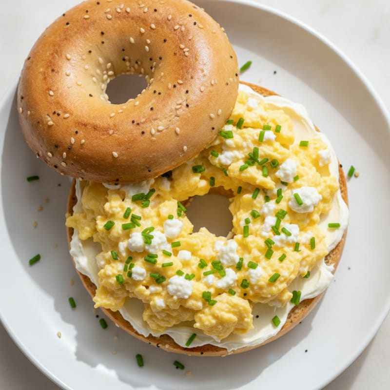 Scrambled Eggs with Cottage Cheese and Chives on Royo Bagel with Cream Cheese