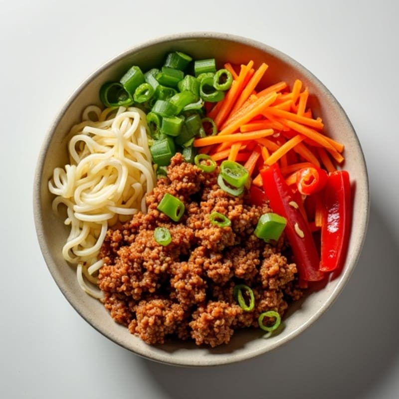 Spicy Ginger-Garlic Ground Pork Noodle Bowl