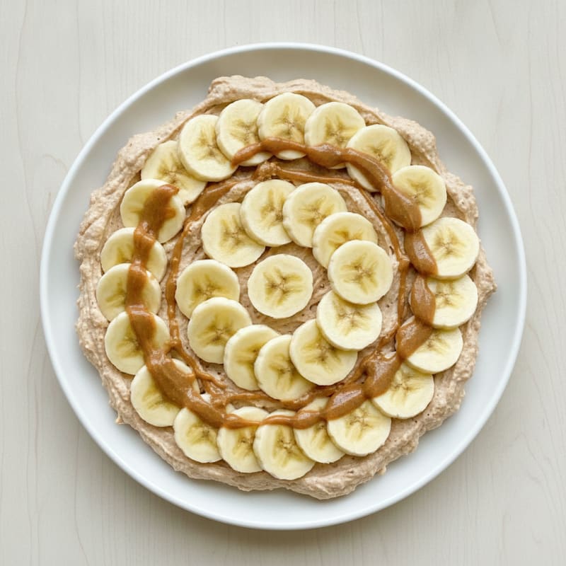 Peanut Butter Yogurt Protein Mousse with Sliced Banana
