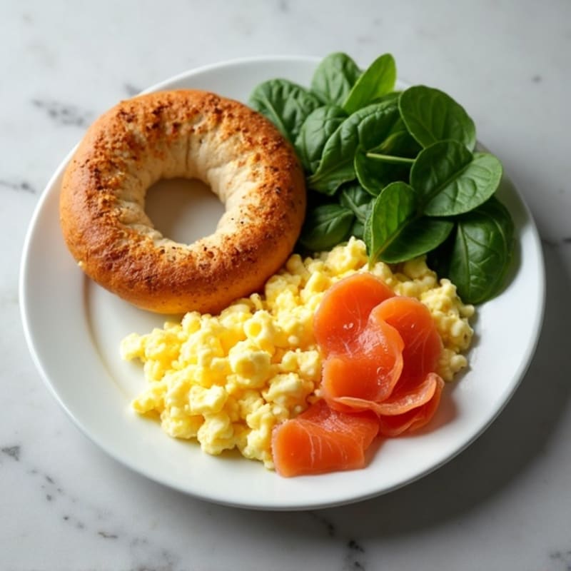 Creamy Scrambled Eggs with Smoked Salmon, Fresh Spinach, and Toasted Whole Wheat Bagel