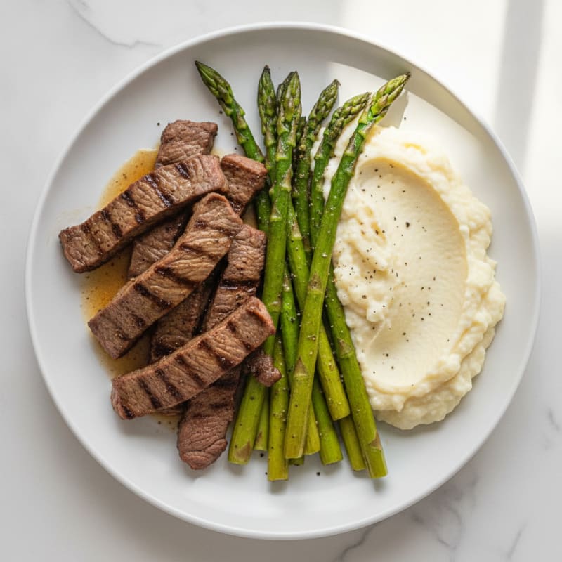 Seared Lean Beef Strips with Roasted Asparagus and Cauliflower Mash