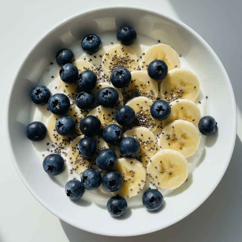 Berry Greek Yogurt Bowl with Sliced Banana and Chia Seeds