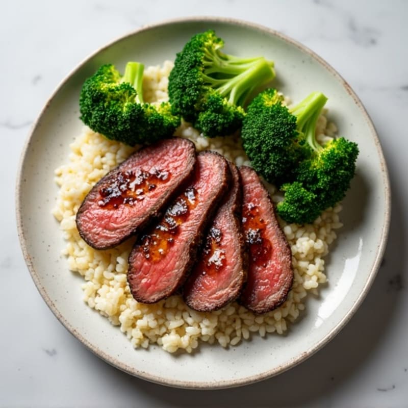 Seared Lean Beef Strips with Steamed Broccoli and Cauliflower Rice