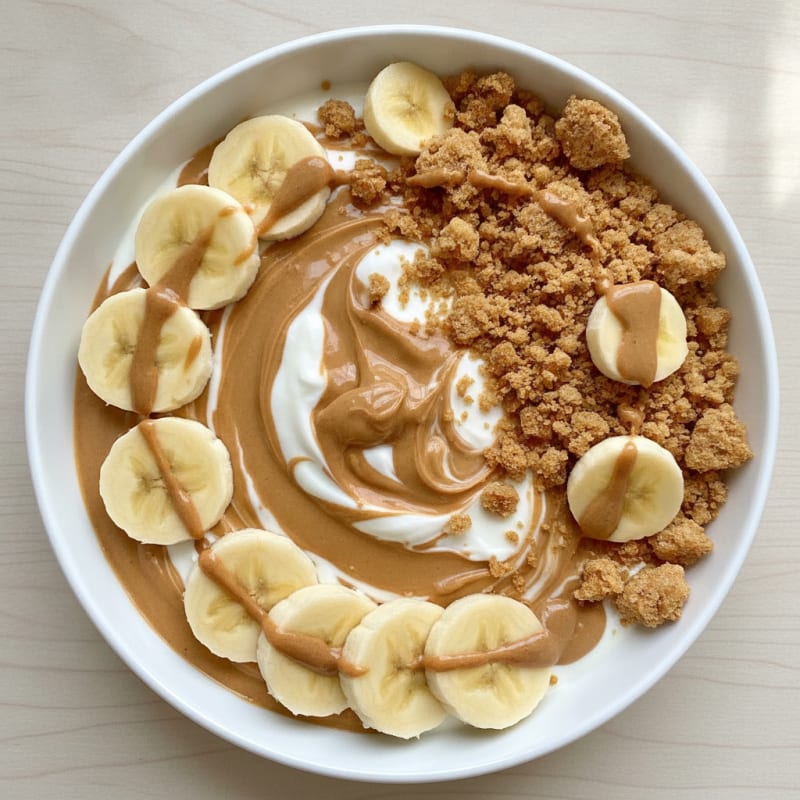 Peanut Butter Greek Yogurt with Sliced Banana and Rice Cakes