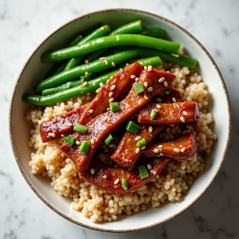 Crispy Sesame Beef and Brown Rice Bowl with Steamed Green Beans