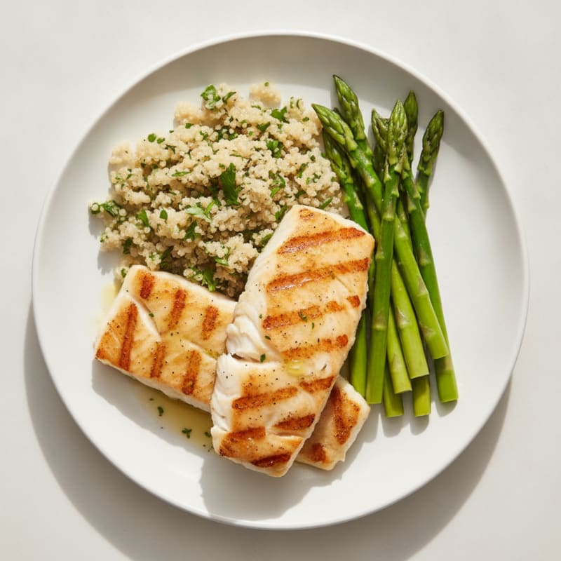 Grilled Cod Fillet with Steamed Asparagus and Lemon Herb Quinoa