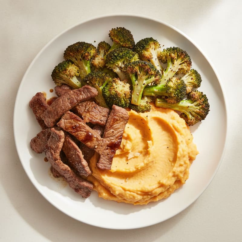 Seared Lean Beef Strips with Roasted Broccoli and Sweet Potato Mash